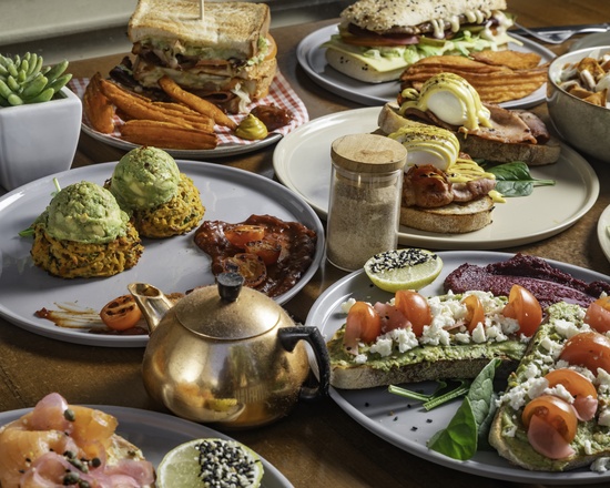A colourful spread of toasties, avocado toast, fritters and tea at Absolute Cravings